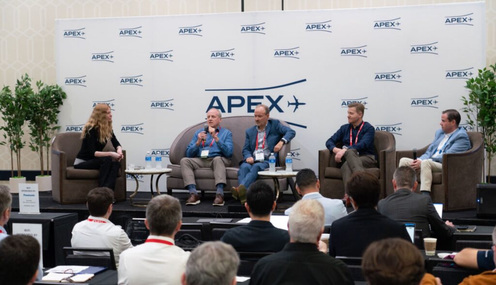 The IFE Revolution panel at APEX TECH from left to right: Moderator Mary Kirby; Quvia's Mike Moeller; ThinKom Solutions' Bill Milroy, ST Engineering iDirect's Chris Insal, and JetBlue's Ken McQuillan.
